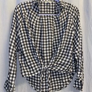 White and black checkered plaid button up shirt.
